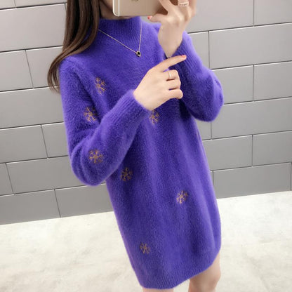 Chique gebreide sweaterjurk met lange mouwen en geborduurde details